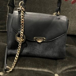 Gianni Versace bag.  Brand new.   Never been used.  Authentic with #